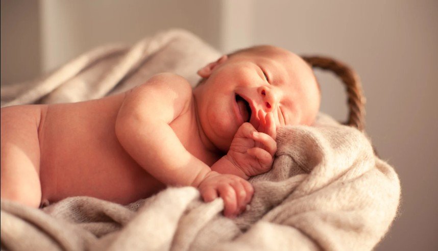 Newborn Giggles in Sleep