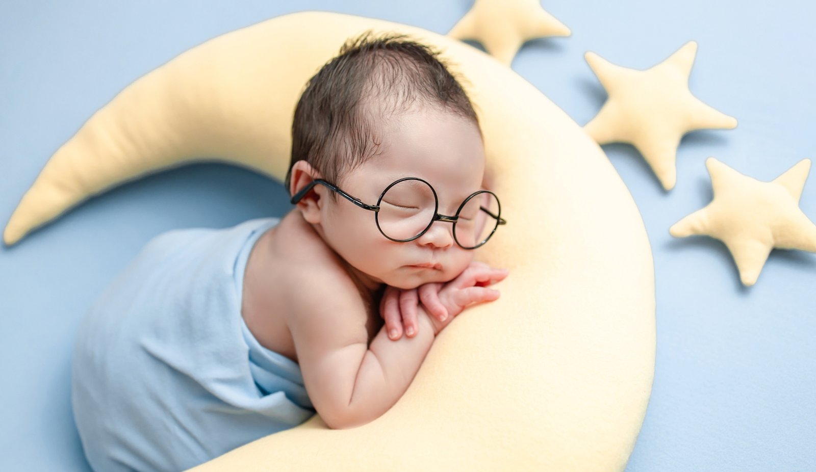Newborn Sleeping on Pillow